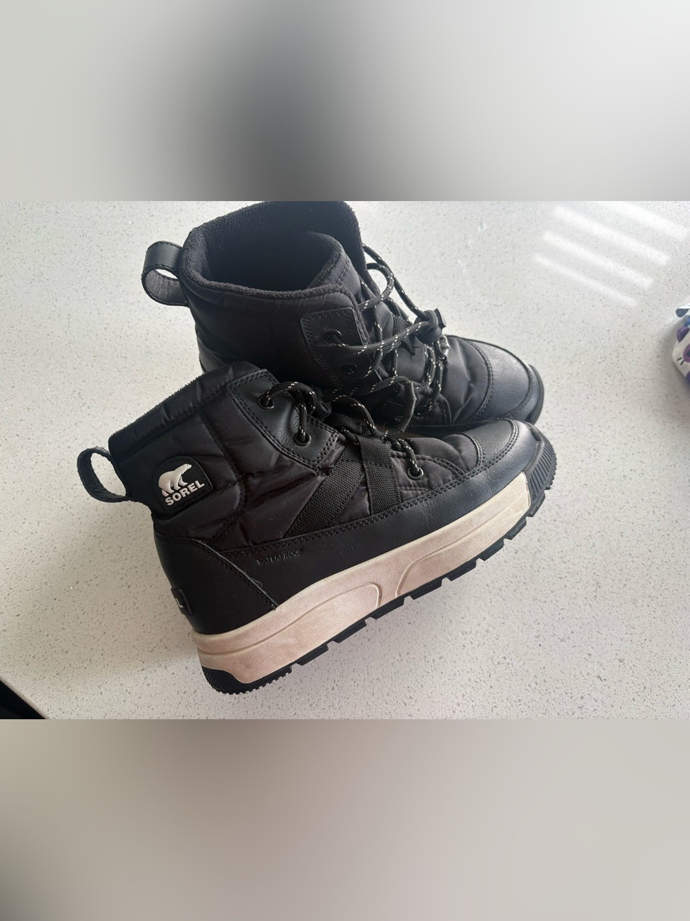 Sorel Black Lace-Up Winter Boots with White Sole